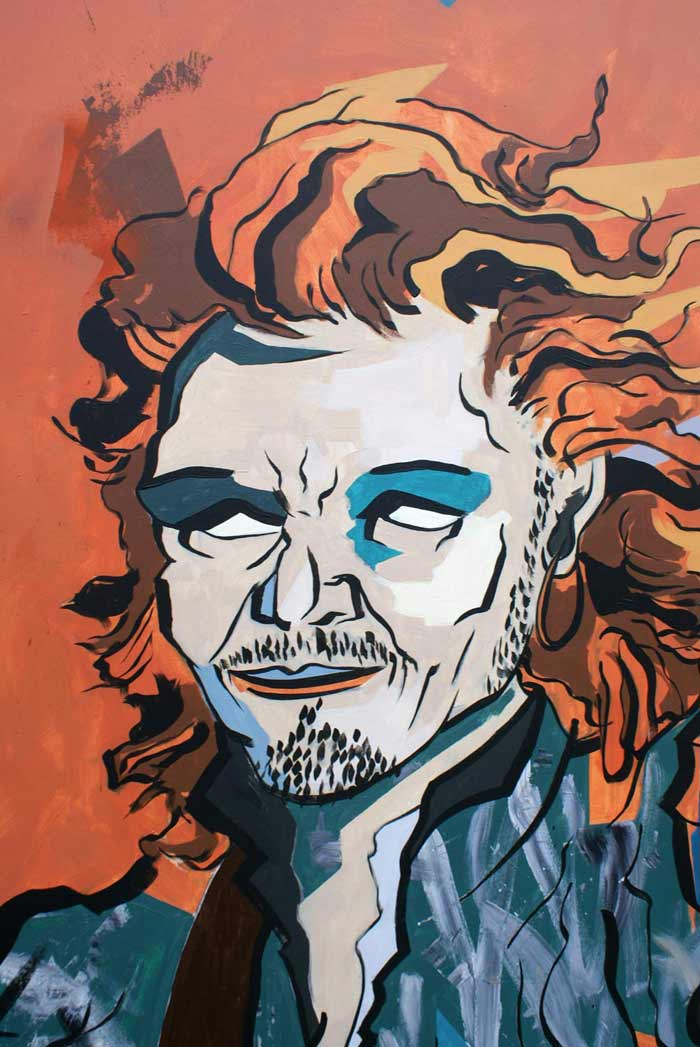 Graffiti maleri på træplade med billede af Orlando Bloom til Ordblindeinstituttet